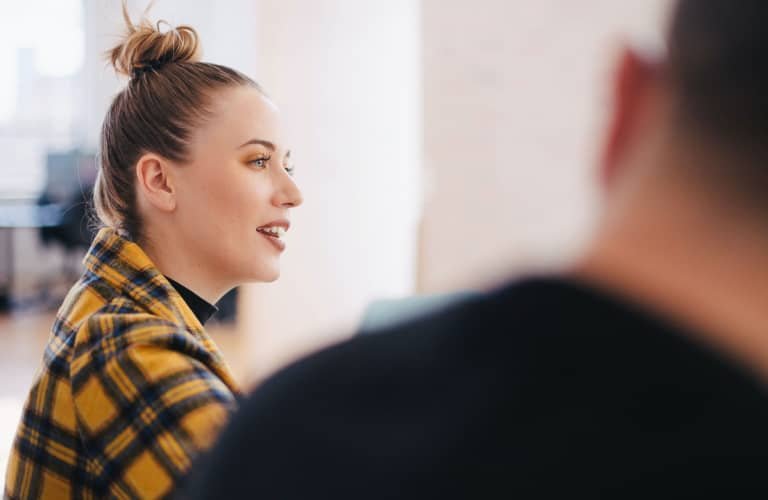 Image of a team member talking during an office meeting